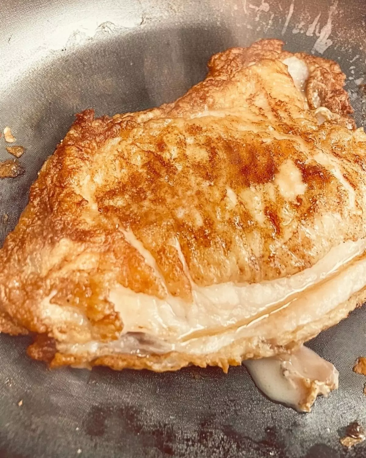 Chicken browning in pan for Pasta Chicken