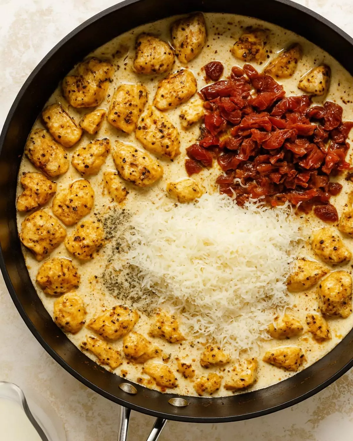 Chicken browning in pan for Pasta Chicken